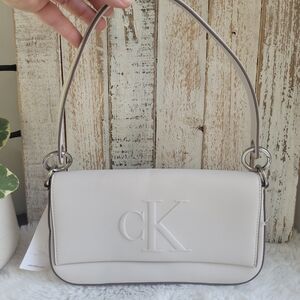 Calvin Klein Jeans Off-White Shoulder Bag with Embossed CK